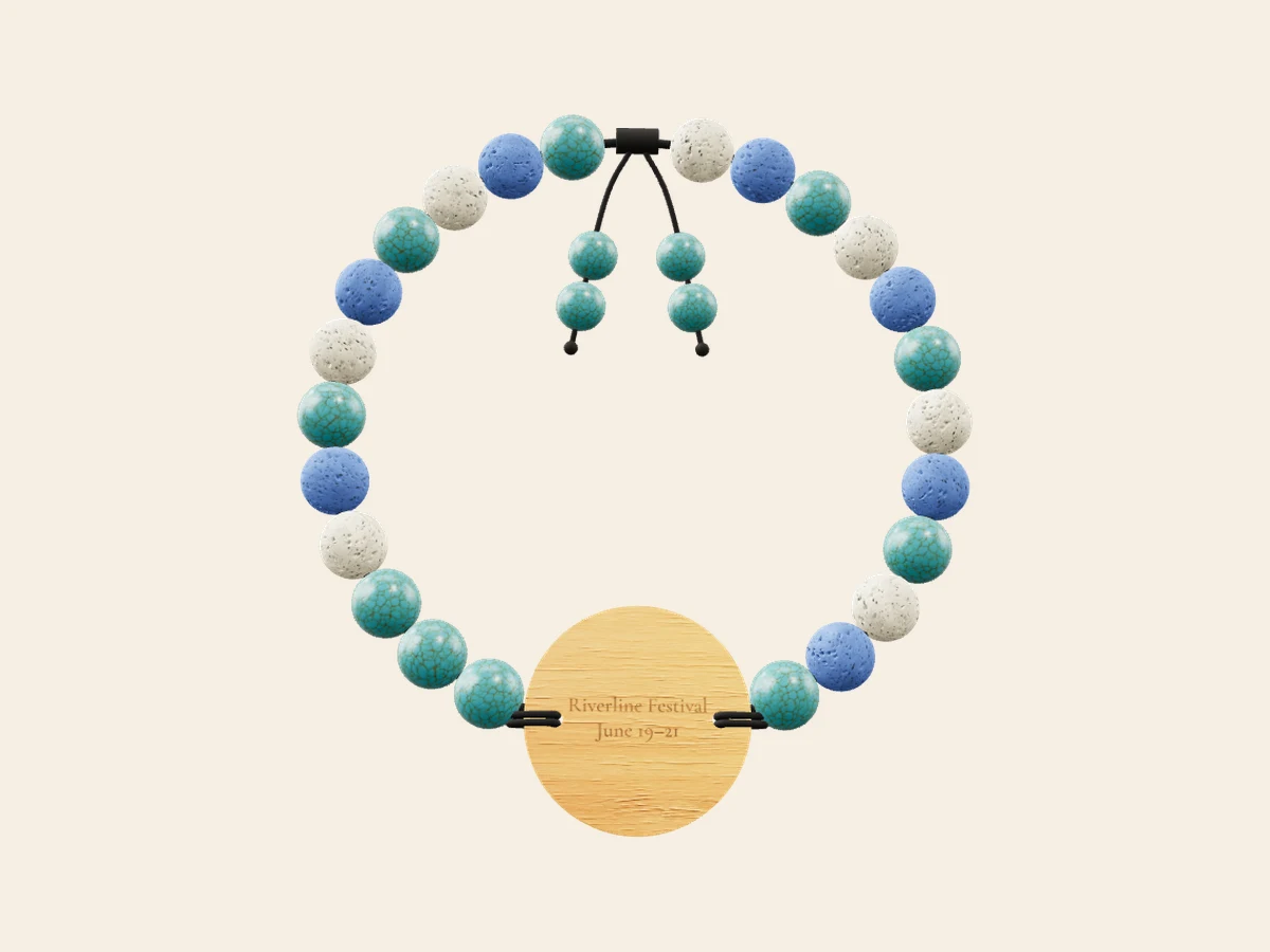 Festival Pass — Turquoise, blue and snow lava on a round bamboo tag. Rendered in the Wearable Events 3D designer.