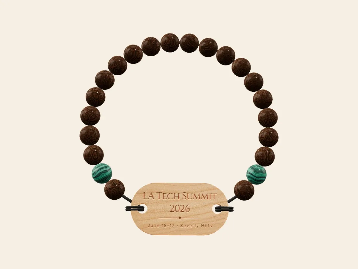 Example summit bracelet with dark wood beads, two green accent beads and a pale engraved wood tag
