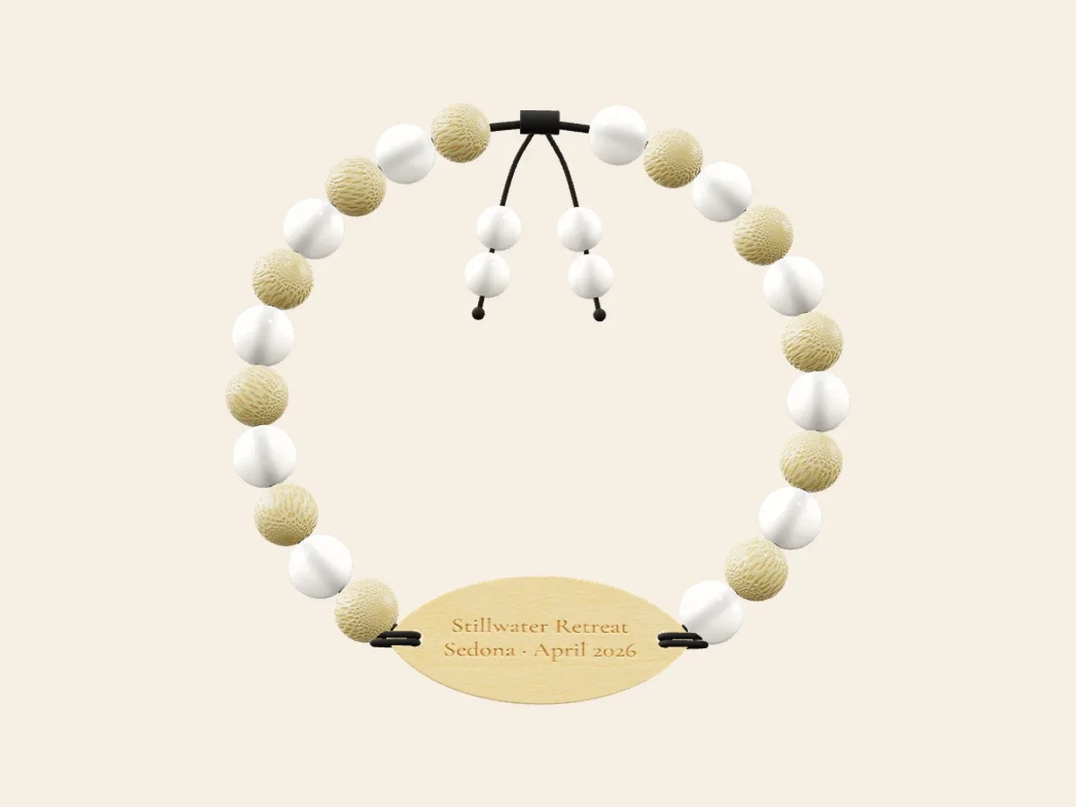 Retreat bracelet render with alternating white and textured pale beads and a leaf-shaped engraved wood tag